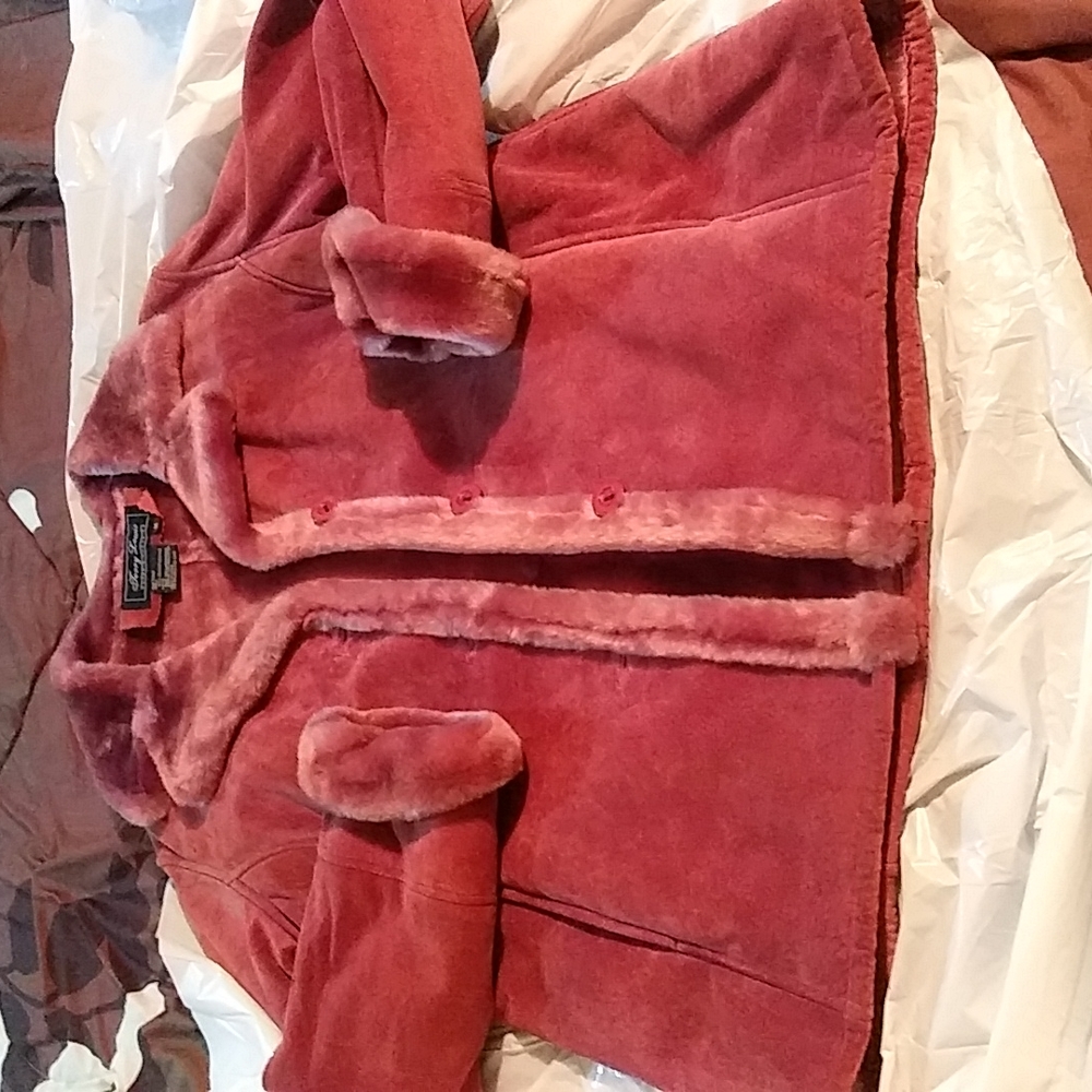 For sale a Terry Lewis Genuine Leather. It s a size Medium color Raspberry